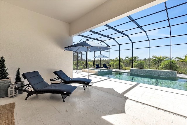 view of swimming pool with a patio, a pool with connected hot tub, and glass enclosure