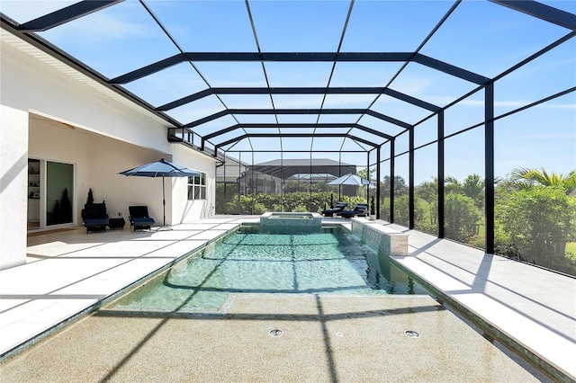 view of pool featuring a lanai, a patio area, and a pool with connected hot tub