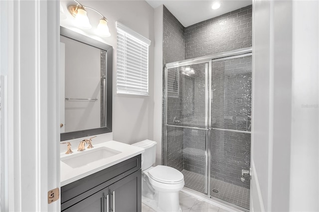 full bathroom featuring marble finish floor, a shower stall, toilet, and vanity