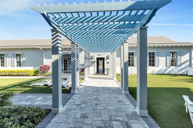 surrounding community with a lawn and a pergola