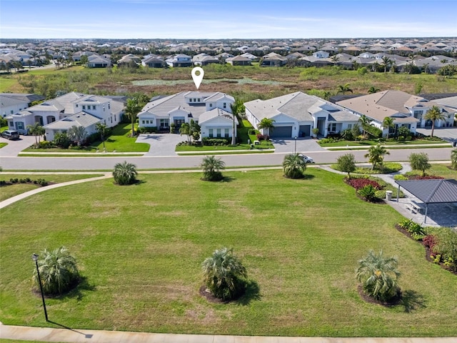 birds eye view of property with a residential view