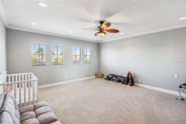 carpeted bedroom featuring a textured ceiling, recessed lighting, baseboards, and ornamental molding