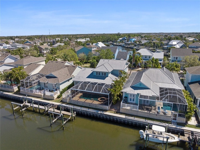 aerial view featuring a residential view and a water view