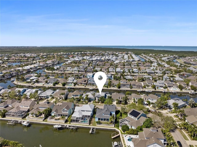 drone / aerial view with a residential view and a water view