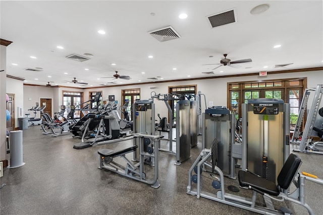 exercise room featuring visible vents, a ceiling fan, and crown molding