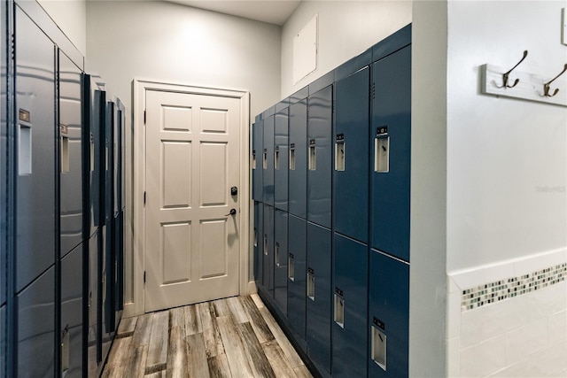 doorway with light wood-style flooring and a package area