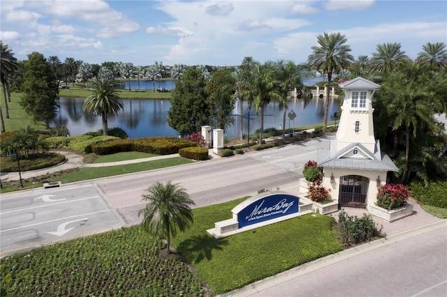 exterior space featuring a water view and uncovered parking