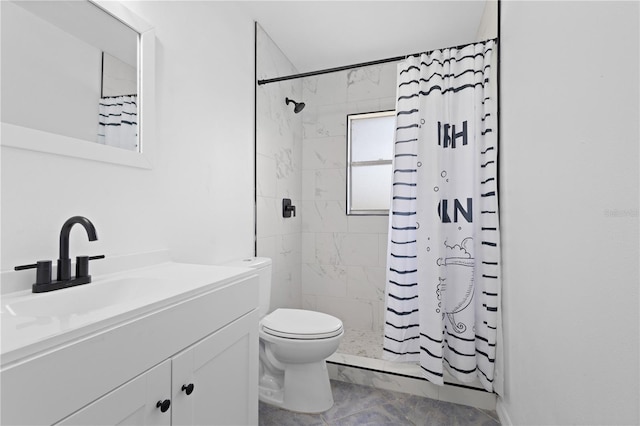 full bathroom featuring toilet, a shower stall, and vanity