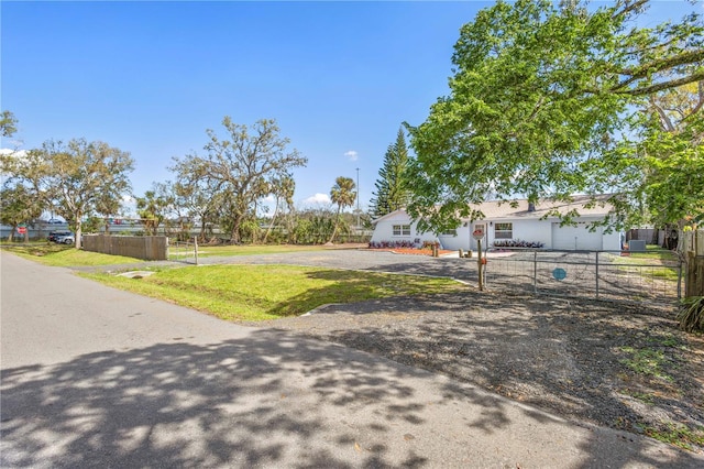 view of front of house featuring a front yard and fence