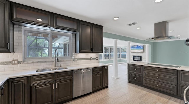 kitchen featuring visible vents, island range hood, dishwasher, black electric cooktop, and a sink