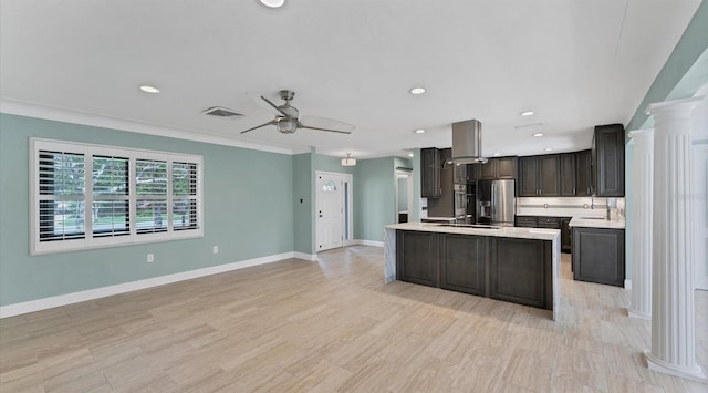 kitchen with baseboards, a ceiling fan, stainless steel fridge with ice dispenser, light countertops, and recessed lighting