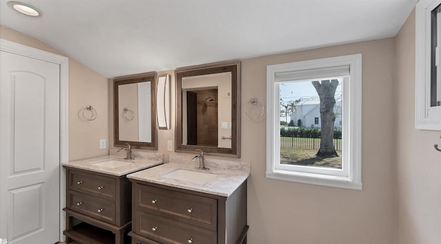 bathroom with two vanities and a sink