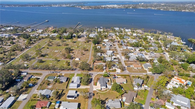 birds eye view of property featuring a residential view and a water view