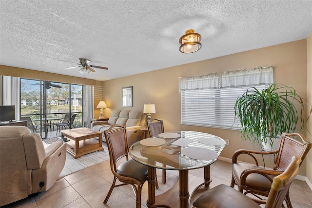 dining room with light tile patterned floors and baseboards