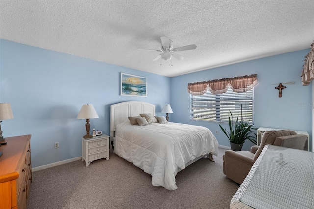 bedroom featuring ceiling fan, carpet floors, a textured ceiling, and baseboards