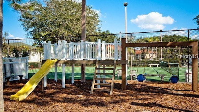 communal playground featuring fence