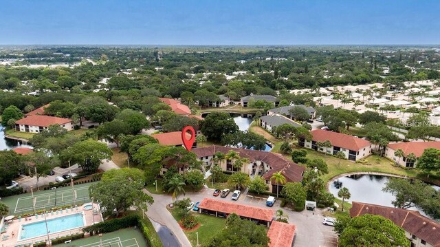 drone / aerial view with a residential view and a water view