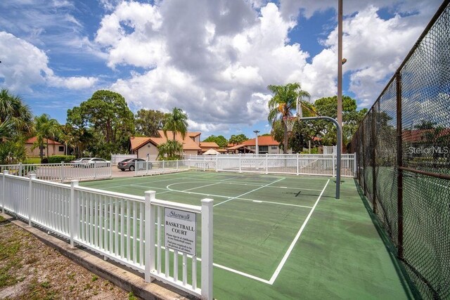 view of sport court with community basketball court and fence