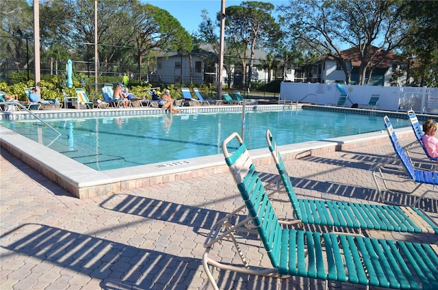 pool featuring a patio and fence