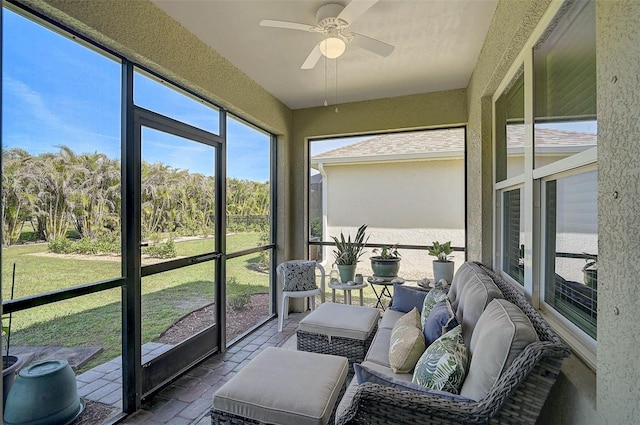 sunroom with ceiling fan