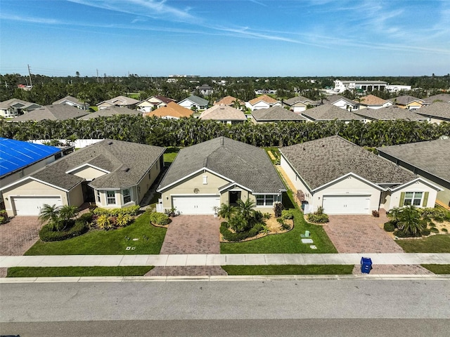 birds eye view of property with a residential view