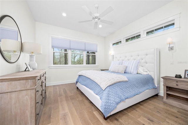 bedroom with light wood finished floors, baseboards, a ceiling fan, and recessed lighting