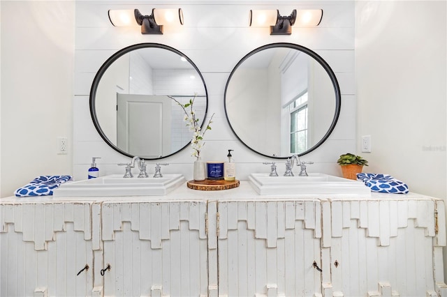 bathroom featuring double vanity and a sink