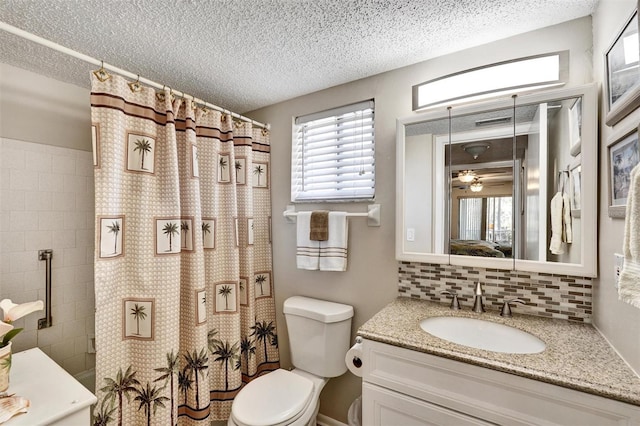 ensuite bathroom with a textured ceiling, curtained shower, toilet, vanity, and tasteful backsplash