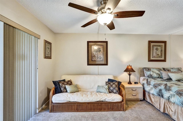 bedroom featuring a textured ceiling, ceiling fan, carpet flooring, and baseboards