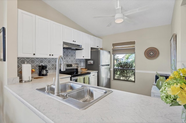 kitchen featuring under cabinet range hood, white cabinetry, appliances with stainless steel finishes, and light countertops