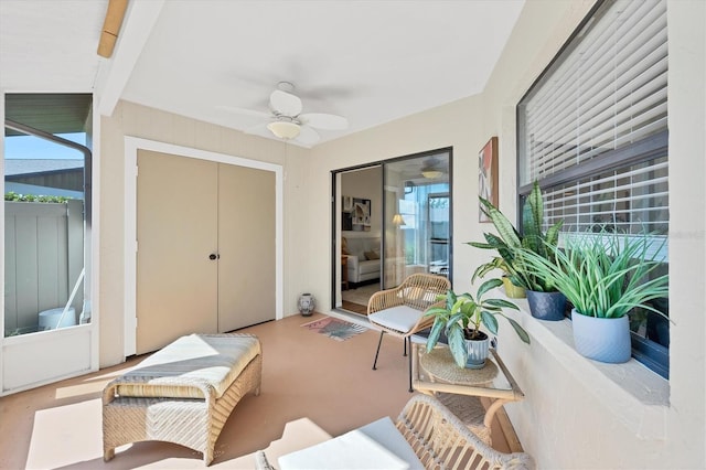 interior space with ceiling fan