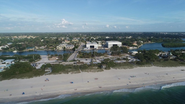 bird's eye view featuring a water view and a view of the beach