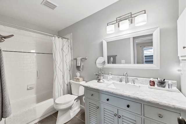 full bathroom featuring toilet, vanity, visible vents, tile patterned floors, and shower / bath combination with curtain