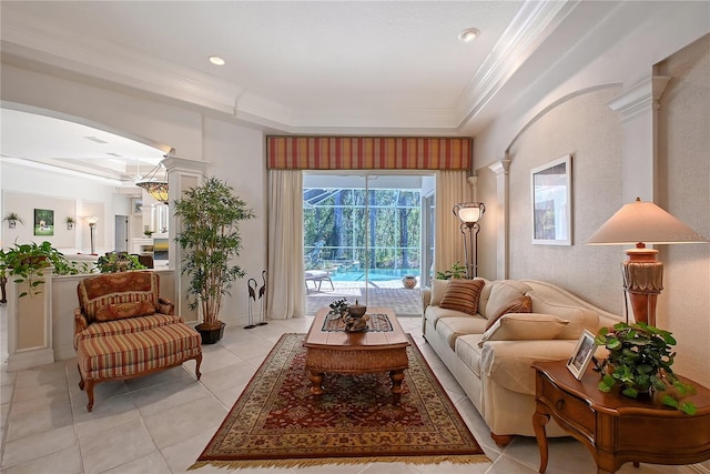 living room featuring crown molding, light tile patterned floors, decorative columns, and a sunroom