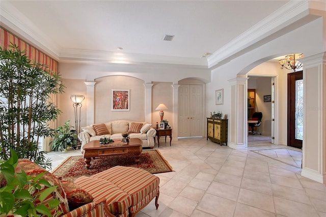 living room featuring light tile patterned floors, visible vents, ornamental molding, and decorative columns