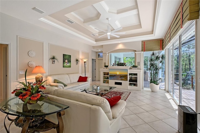 living room featuring light tile patterned floors, visible vents, a fireplace, ceiling fan, and ornamental molding