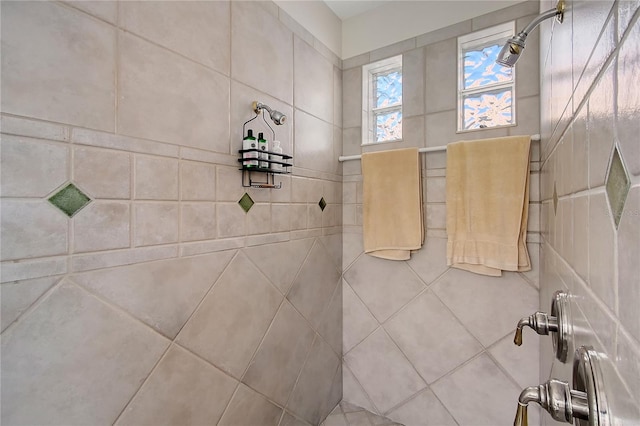 full bath featuring a tile shower