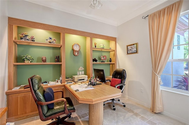 tiled home office with a healthy amount of sunlight and baseboards