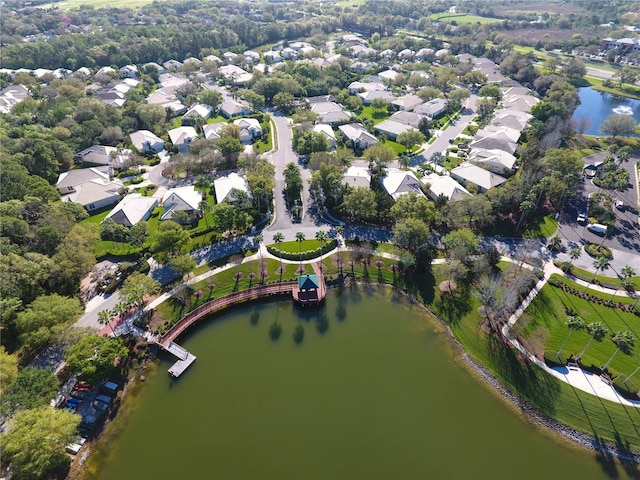 bird's eye view with a residential view and a water view