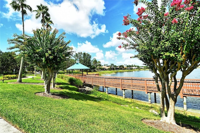 exterior space with a gazebo, a water view, and a lawn