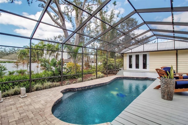 outdoor pool with a patio and a lanai