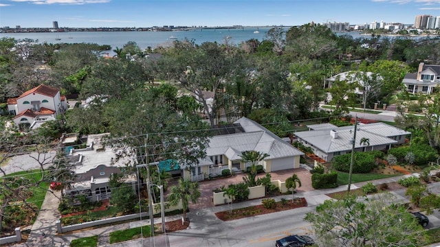 birds eye view of property featuring a water view and a residential view