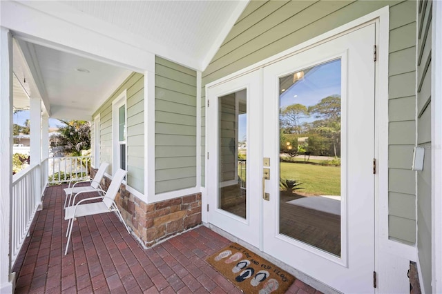 exterior space with a sunroom and french doors