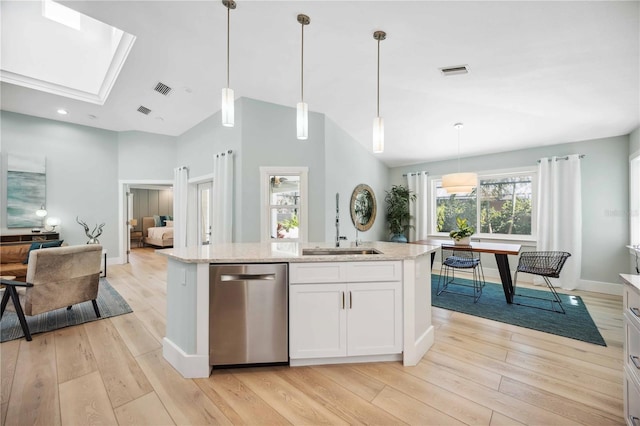 kitchen featuring a sink, white cabinets, hanging light fixtures, light stone countertops, and dishwasher