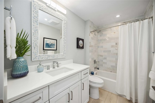 full bath featuring visible vents, toilet, shower / tub combo, vanity, and wood finished floors