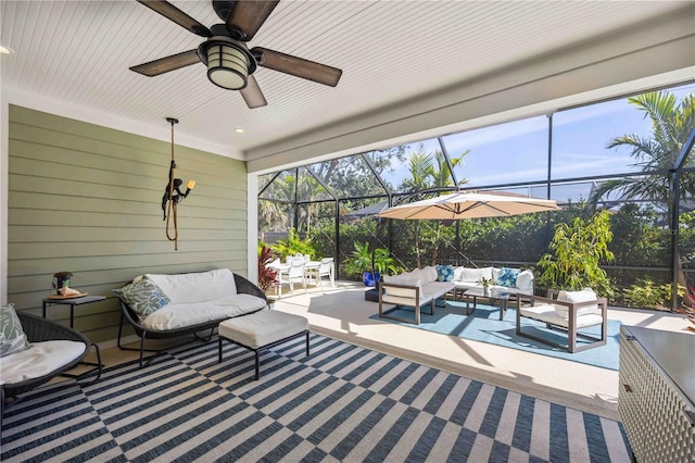 sunroom / solarium featuring ceiling fan