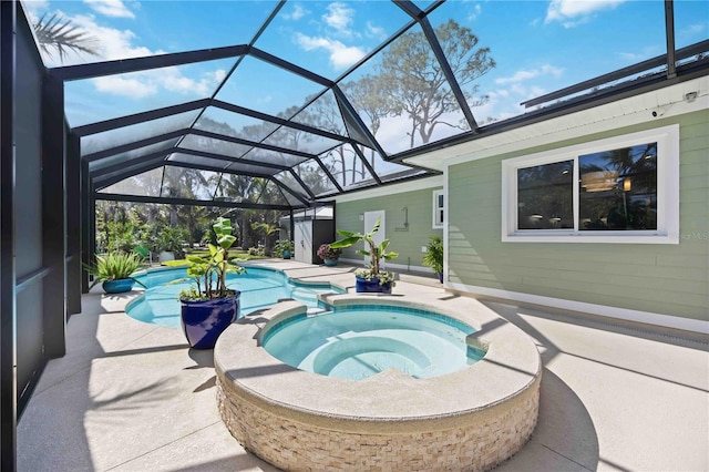 view of swimming pool featuring glass enclosure, a patio area, and a pool with connected hot tub