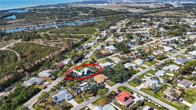 birds eye view of property featuring a water view and a residential view