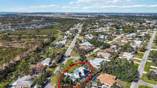 aerial view with a residential view and a water view