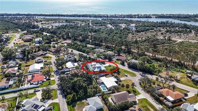 bird's eye view featuring a water view and a residential view